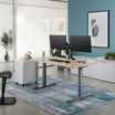 lowered light wood silver finish desk in a home office setting
